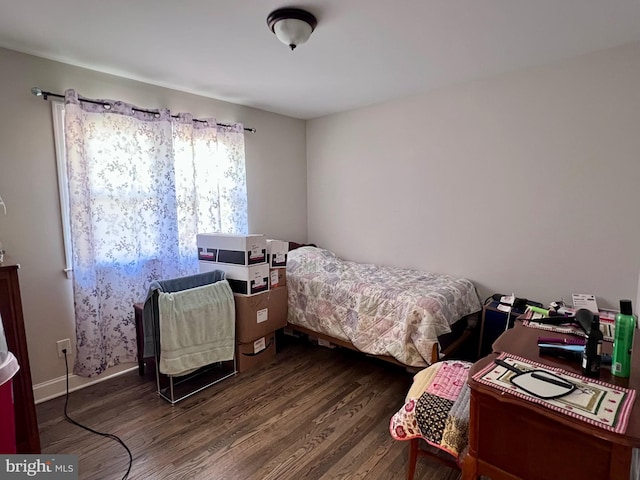 bedroom featuring dark wood-type flooring