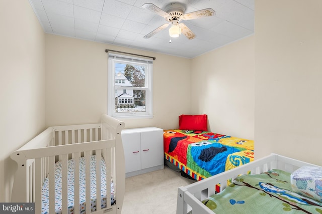 carpeted bedroom featuring ceiling fan