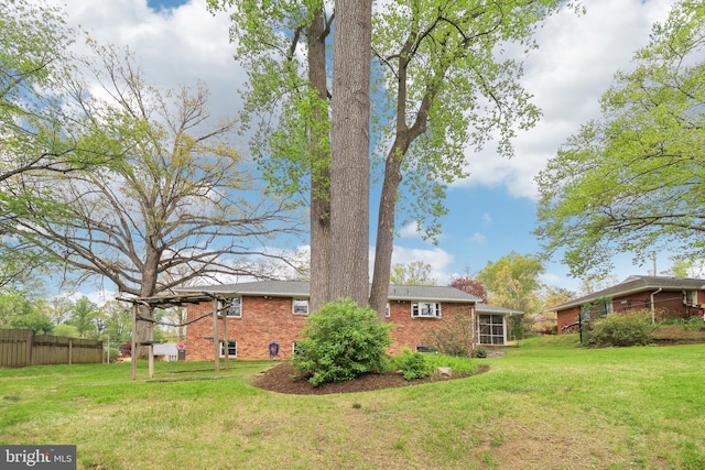 view of yard featuring fence