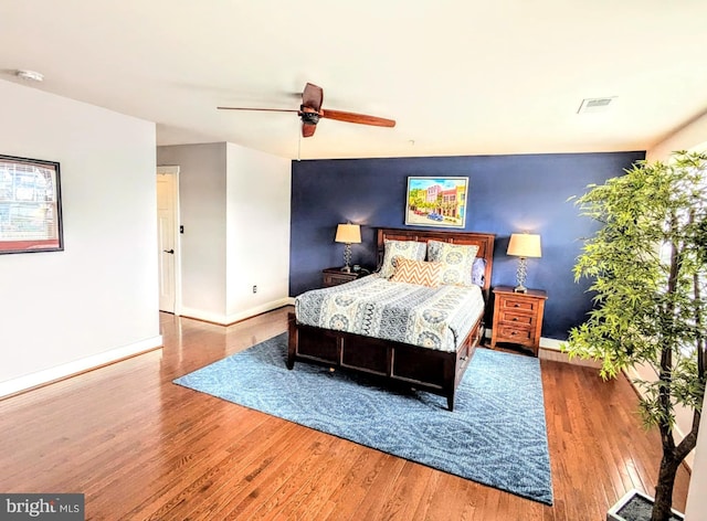 bedroom featuring ceiling fan and hardwood / wood-style floors