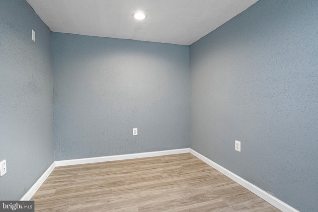 spare room featuring light hardwood / wood-style floors