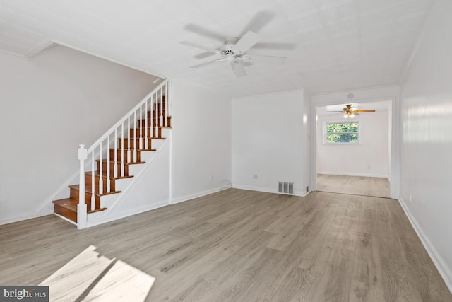 unfurnished living room featuring light hardwood / wood-style floors and ceiling fan