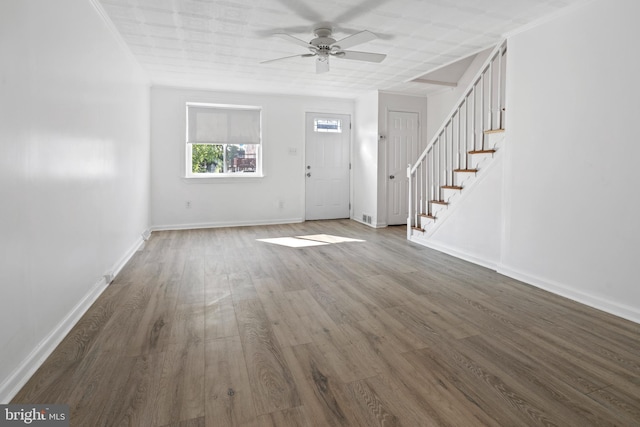 foyer entrance with ceiling fan and dark hardwood / wood-style flooring