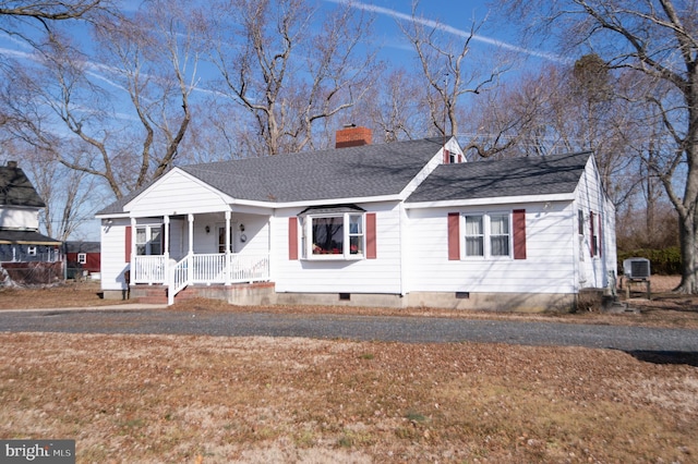 view of front of property with a front yard and covered porch