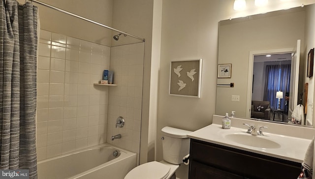 full bathroom with shower / bath combination with curtain, vanity, and toilet