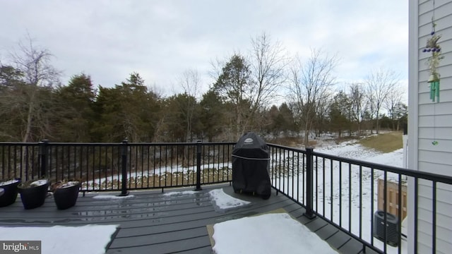 view of snow covered deck