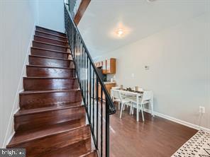 stairway with wood-type flooring