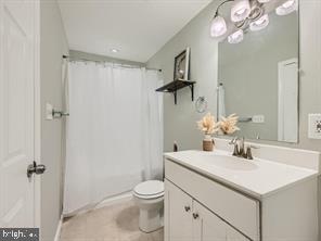 bathroom with vanity, tile patterned floors, and toilet