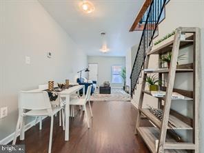 dining area featuring dark wood-type flooring