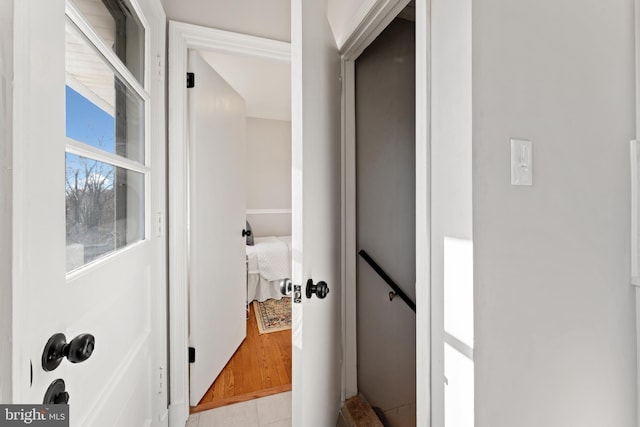 corridor featuring light tile patterned floors