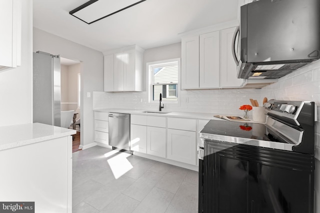 kitchen featuring white cabinetry, sink, and stainless steel appliances