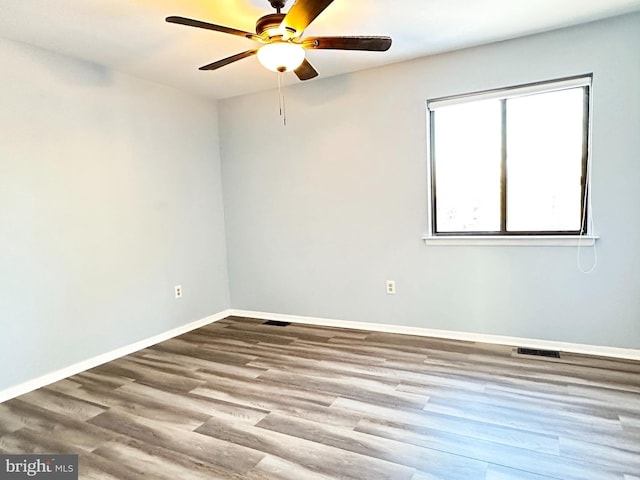 unfurnished room with ceiling fan and light hardwood / wood-style flooring