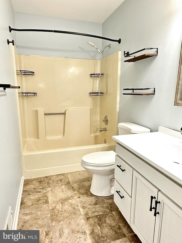 full bathroom featuring vanity, tub / shower combination, and toilet