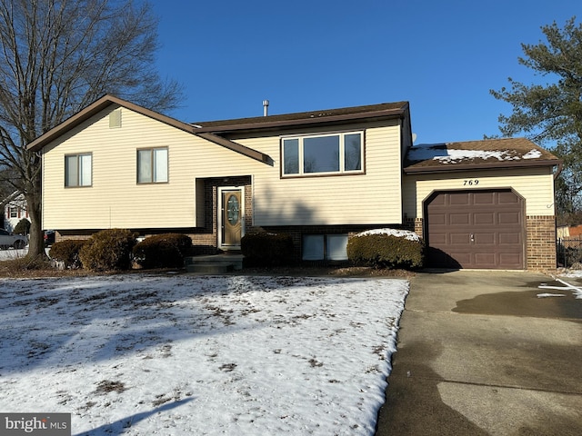 raised ranch featuring a garage