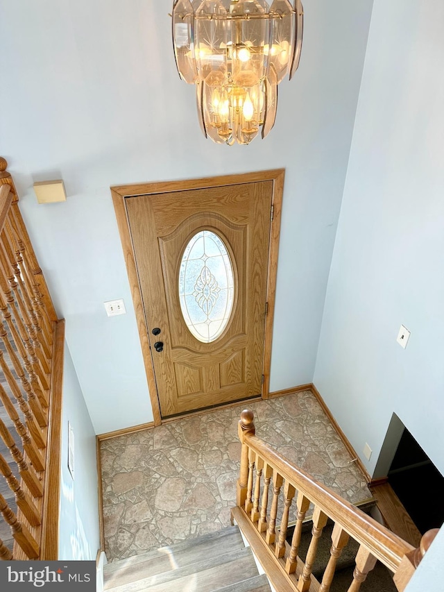 entryway with a notable chandelier