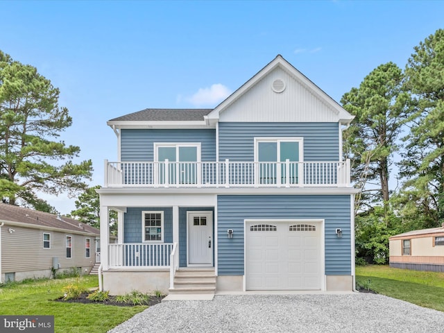 view of front of property featuring a garage and a balcony