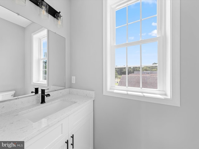 bathroom with vanity and toilet