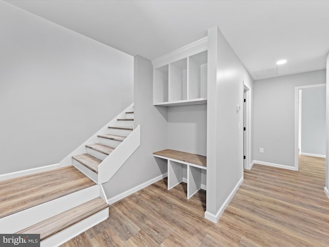 staircase featuring hardwood / wood-style flooring