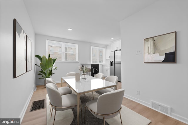 dining room featuring light hardwood / wood-style flooring