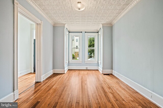 1324 Montello Ave NE, Washington, DC 20002 - unfurnished room with ornamental molding, wood-type flooring, baseboards, and an ornate ceiling
