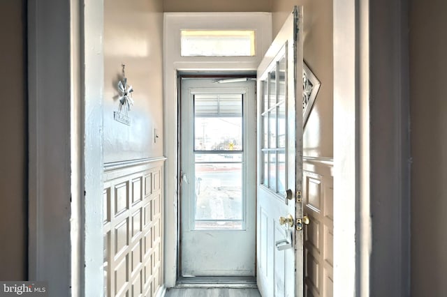 entryway with hardwood / wood-style flooring