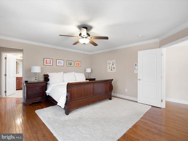 bedroom featuring dark hardwood / wood-style flooring, crown molding, and ceiling fan