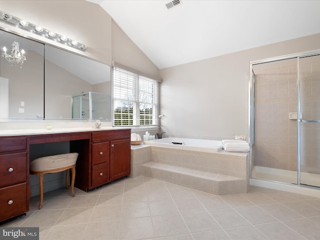 bathroom with lofted ceiling, tile patterned floors, and vanity