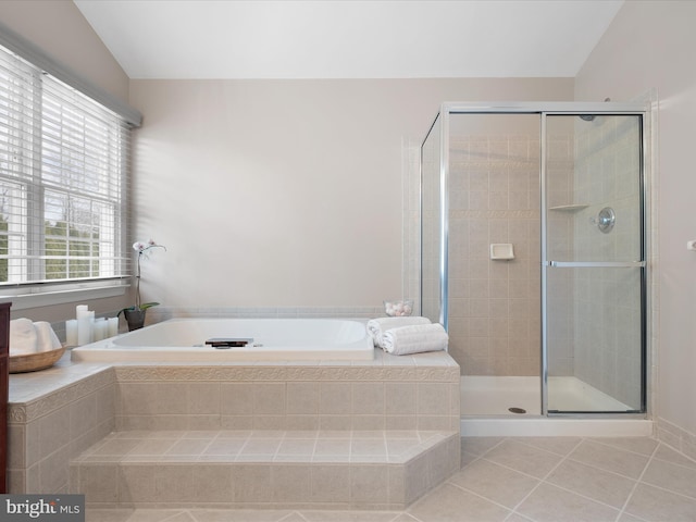 bathroom with tile patterned floors, lofted ceiling, and an enclosed shower