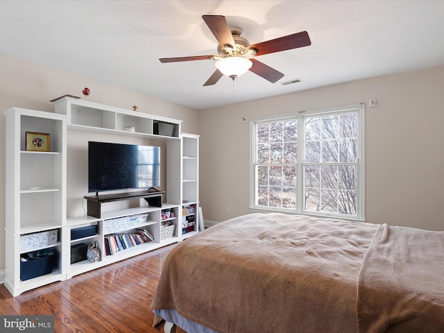 bedroom with hardwood / wood-style flooring and ceiling fan