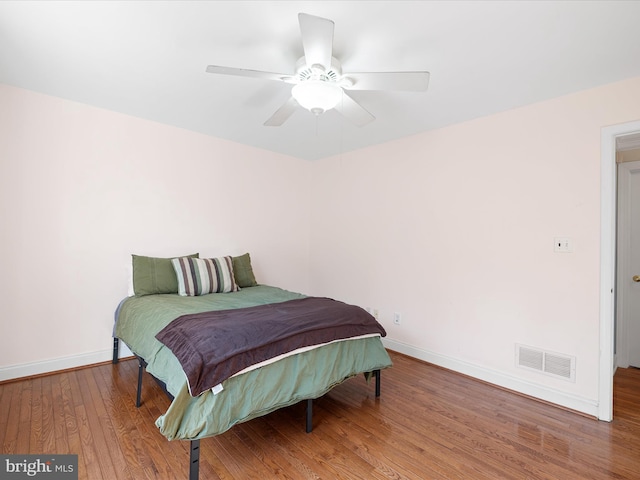 bedroom featuring ceiling fan and hardwood / wood-style floors