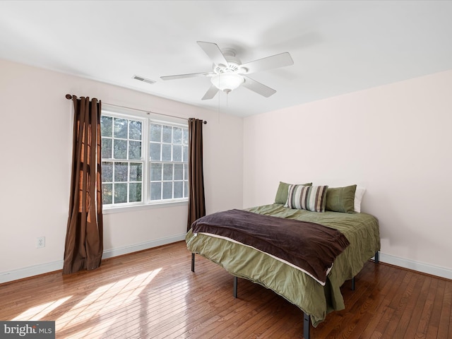 bedroom with hardwood / wood-style flooring and ceiling fan