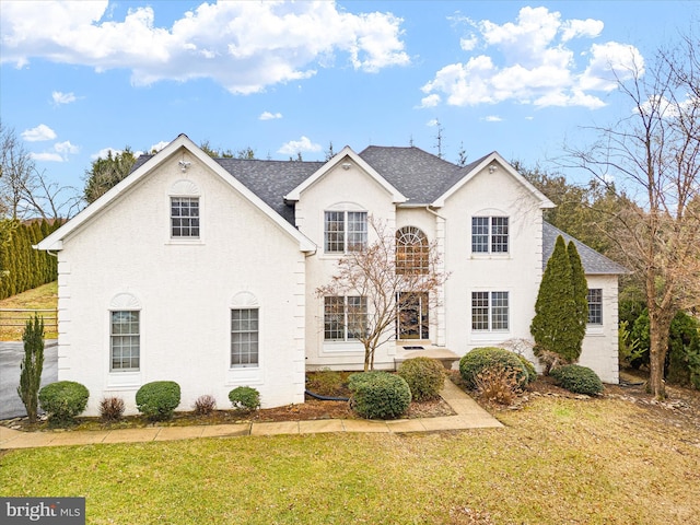 view of front of property with a front lawn