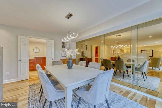 dining space featuring light hardwood / wood-style flooring