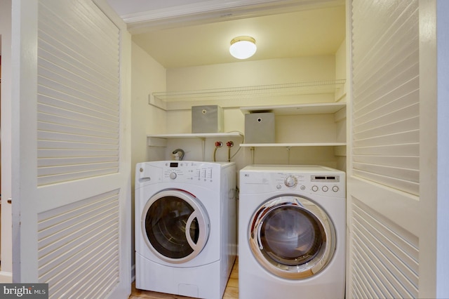 clothes washing area featuring washing machine and dryer