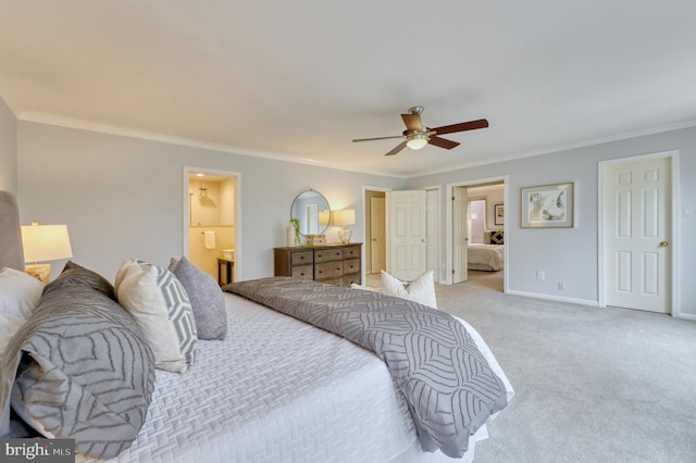 bedroom with ornamental molding, connected bathroom, light colored carpet, and ceiling fan