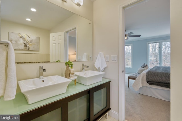 bathroom featuring vanity, ornamental molding, and ceiling fan