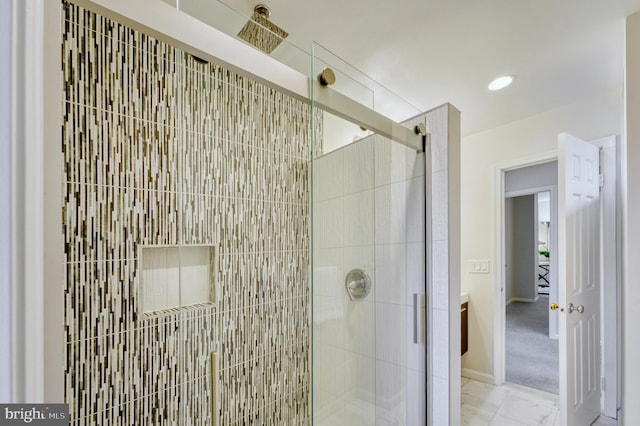 bathroom with a shower with shower door