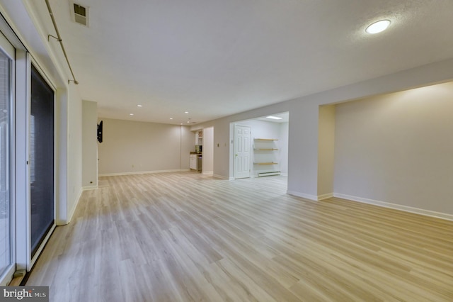 unfurnished living room with light wood-type flooring