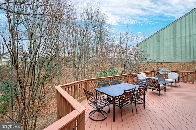 deck featuring grilling area and outdoor lounge area