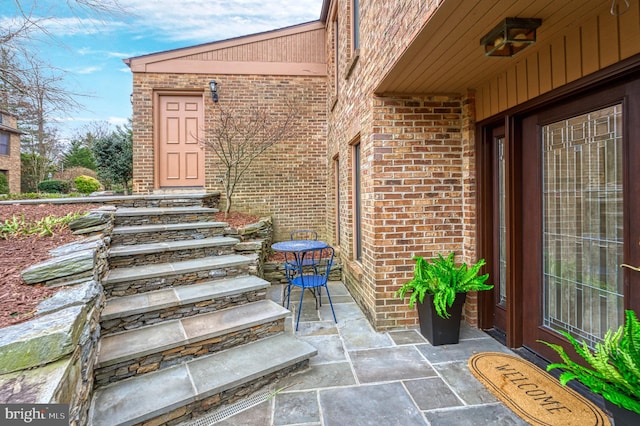 doorway to property featuring a patio