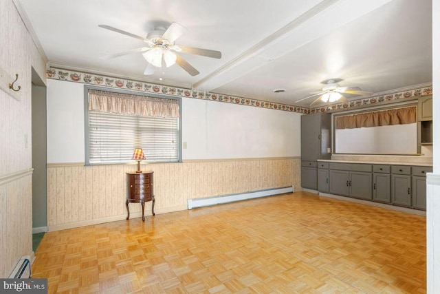 spare room with ceiling fan, light parquet flooring, and a baseboard heating unit