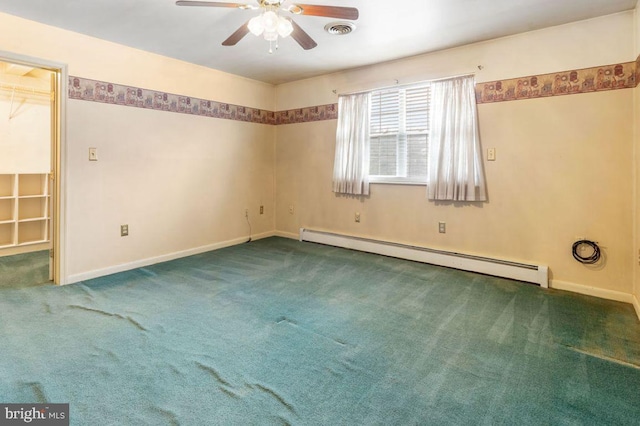 spare room featuring ceiling fan, dark carpet, and baseboard heating