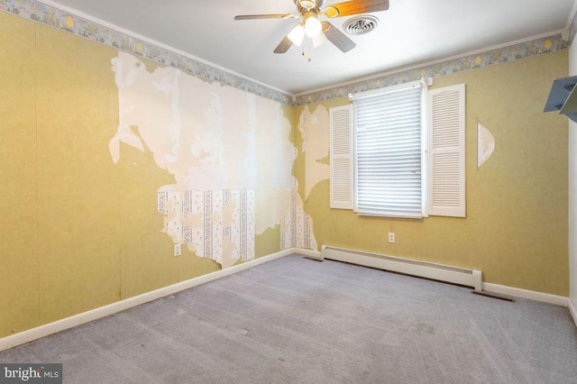 carpeted empty room with crown molding, ceiling fan, and baseboard heating