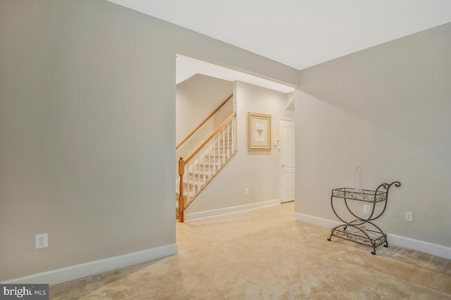 interior space featuring light carpet