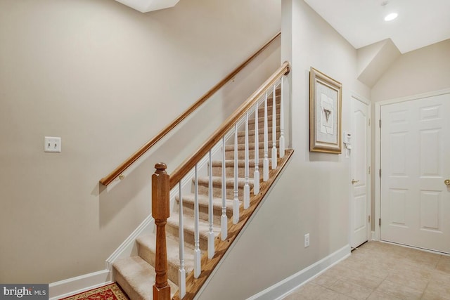 stairs with tile patterned floors