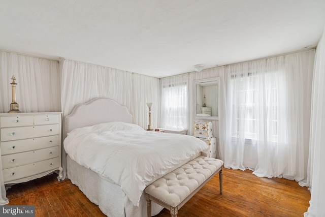 bedroom featuring dark hardwood / wood-style floors