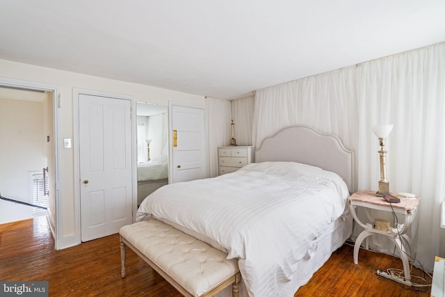 bedroom featuring dark wood-type flooring