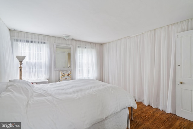 bedroom featuring dark hardwood / wood-style floors