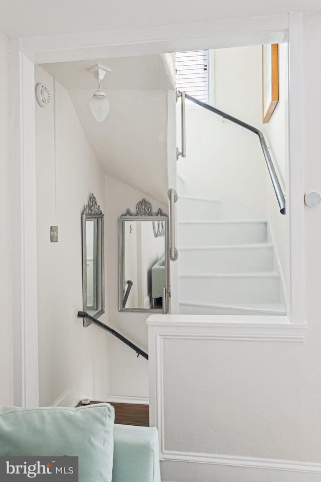 stairs with lofted ceiling