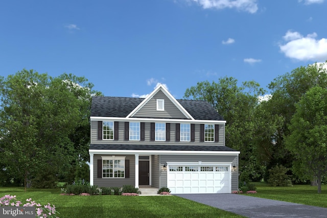 view of front facade with a garage and a front yard